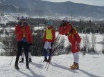 Utah coach Eli Brown chats with women racers and volunteers while waiting for men to lap